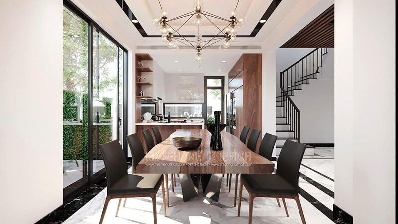 Mẫu bàn ăn gỗ óc chó và ghế ăn bọc nệm hiện đại đã được kết hợp với nhau tạo nên một bộ bàn ăn đẹp cho không gian phòng ăn biệt thự của gia chủ.